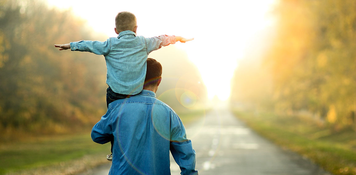 father and son walk in nature