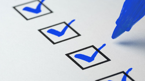 Orange marking on checklist box with pen, Checklist concept