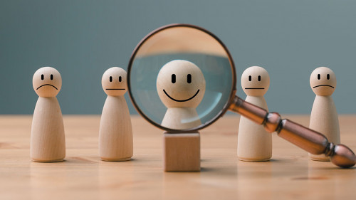 HRM or Human Resource Management, Magnifier glass focus to manager icon which is among staff icons for human development recruitment leadership and customer target group concept.