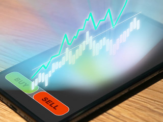 Stock Trading on a smartphone with chart and analysis as hologra