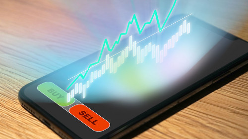 Stock Trading on a smartphone with chart and analysis as hologra