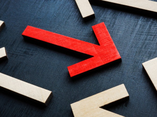 Concept of new different thinking and individuality. The red arrow is in the opposite direction to the rest.