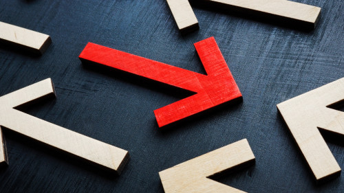 Concept of new different thinking and individuality. The red arrow is in the opposite direction to the rest.