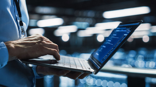 Data Center Programmer Using Digital Laptop Computer, Maintenanc