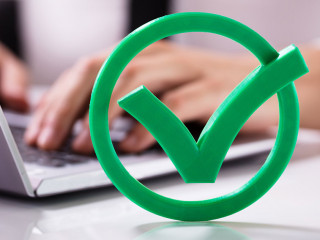 Close-up Of Green Check Mark Sign