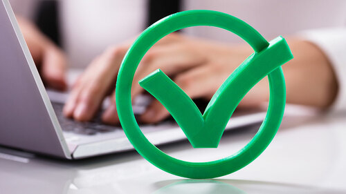 Close-up Of Green Check Mark Sign