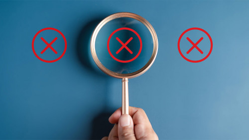 Businessman holding magnifier focus to correct icon which among wrong icon on wooden block for document and project approve, check, mark.