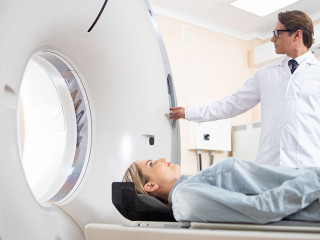 Young lady having CT scan in hospital