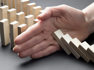 The financial crisis and economic decline. Businessman hand stop