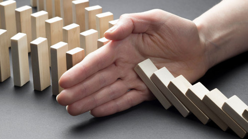 The financial crisis and economic decline. Businessman hand stop