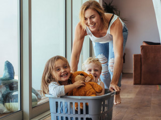 Mother playing with her children at home