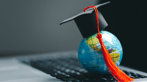 Graduation cap with Earth globe. Concept of global business study, abroad educational, Back to School. Education in Global world, Study abroad business in universities in worldwide. language study