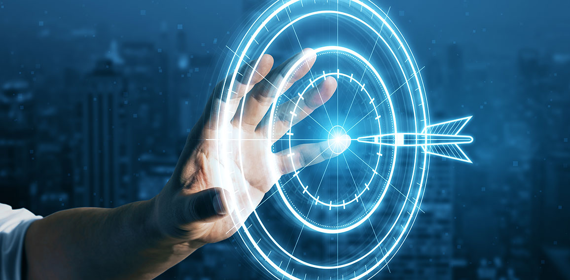 Target concept with a glowing hologram of bullseye and arrow hitting the center. Goals achievement, success. Close up of businessman hand using hud screen on blurry night city background.