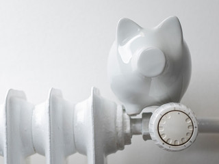 heater money pig on white wall