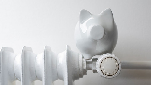 heater money pig on white wall