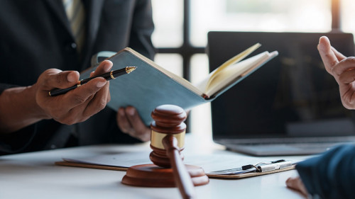 Lawyer and client sign variou financial legal contract to mediat