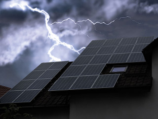 Dark cloudy sky with lightning over house. Stormy weather