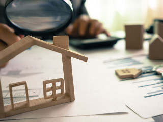 Real estate or House Appraisal using magnifying glass over the m