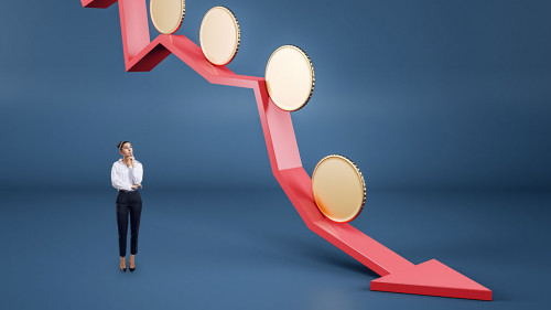 Attractive thoughtful young businesswoman with abstract falling red arrow with empty golden coins on blue background with mock up place. Crisis, downfall and currency concept.