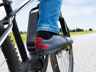 Man Riding Electric Mountain Bike