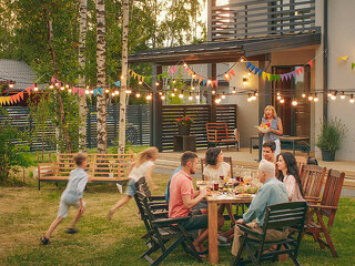 Big Family Garden Party Celebration, Gathered Together at the Ta