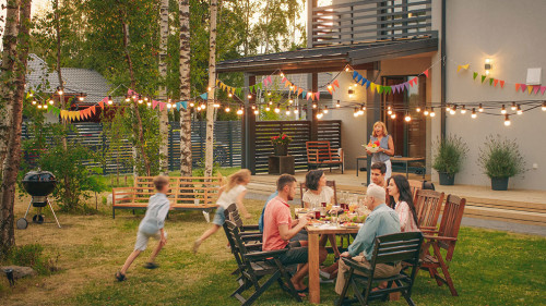 Big Family Garden Party Celebration, Gathered Together at the Ta