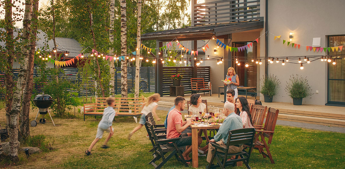 Big Family Garden Party Celebration, Gathered Together at the Ta