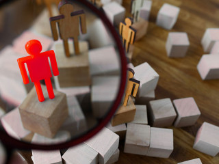 Businessman hold in hand magnifying glass