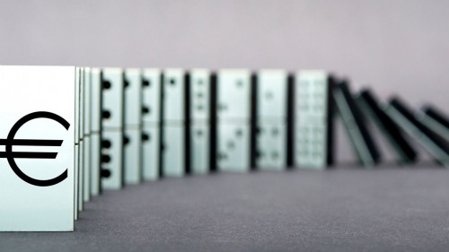 Dominoes falling in a row , gray background