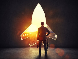 Concept of startup with a rocket shape hole in the wall which alludes to the departure towards new goals