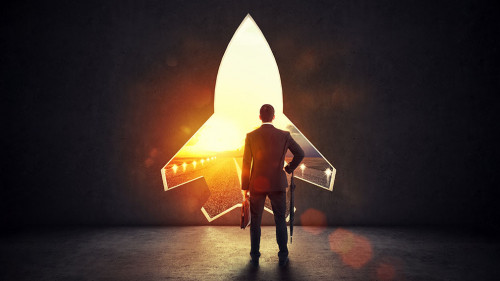 Concept of startup with a rocket shape hole in the wall which alludes to the departure towards new goals