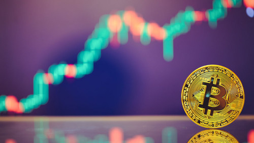 Bitcoin is a gold coin and a defocused graphics background. on t