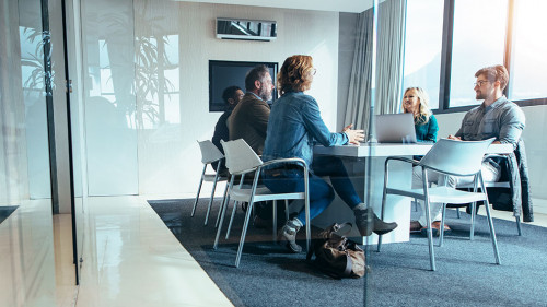 Group of business people having discussion in conference room