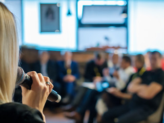Female presenter speaks to audiences