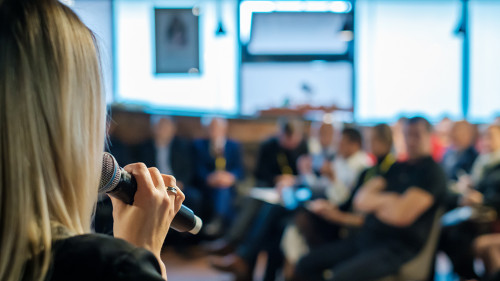 Female presenter speaks to audiences