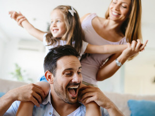 Happy family having fun times at home