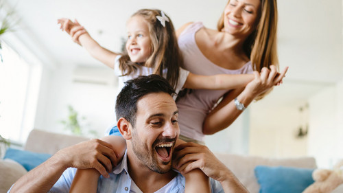 Happy family having fun times at home