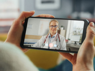 Close Up of a Female Chatting in a Video Call with Her Female Fa