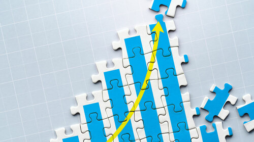 Creation of growth. Growth chart drawn on puzzle.