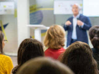 Business forum visitors register at the front desk