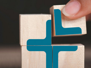 Plus sign in wooden cube block stack. added value, benefits, add