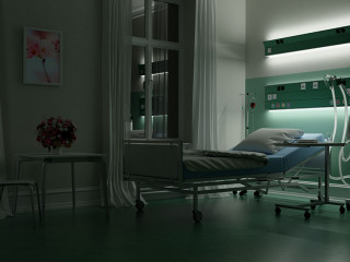 Bett in Krankenzimmer in Krankenhaus bei Nacht