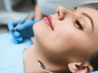 Relaxed young female at dentist stock photo
