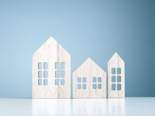 House real estate and construction background, wooden model hous