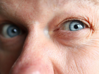 Suspicious male worker trying to see something