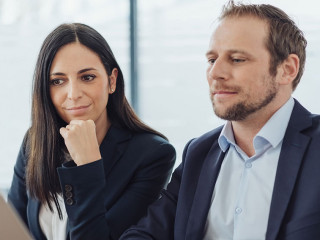 stylish businessman and woman working together