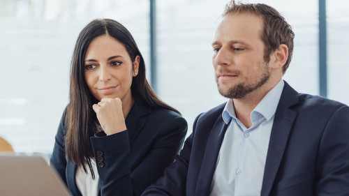 stylish businessman and woman working together