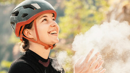 Climber wearing in climbing equipment. Practicing rock-climbing