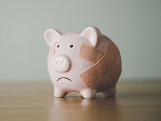 Piggy bank on wood table. Financial investment and save money concept