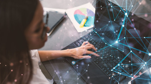 Businesswoman works in office with a laptop with internet effects. Concept of internet sharing and company startup